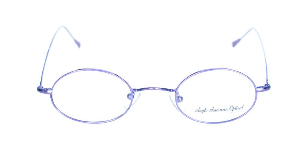 A pair of purple glasses with a silver rim.