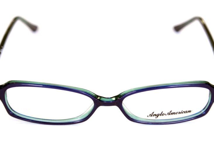 A pair of glasses with blue frames and black tips.