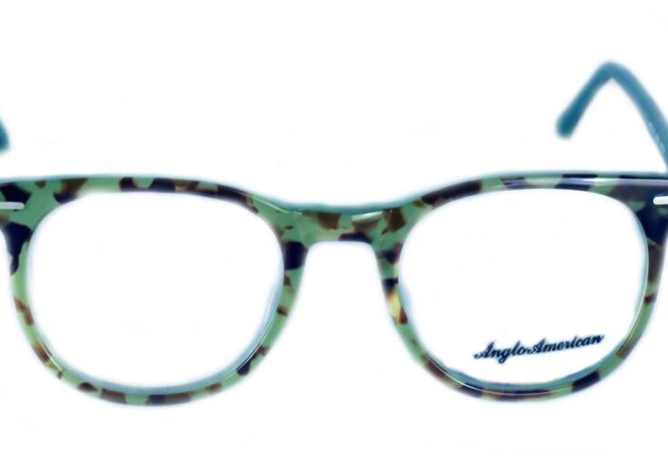 A pair of glasses is shown with the reflection of the camera.