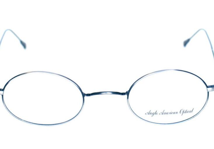 A pair of glasses with the words " hugh laurie " written on them.