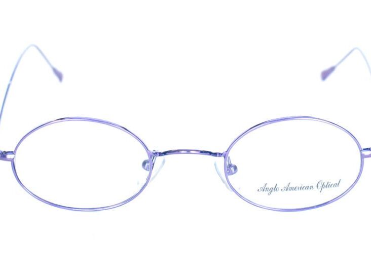 A pair of purple glasses with a silver rim.